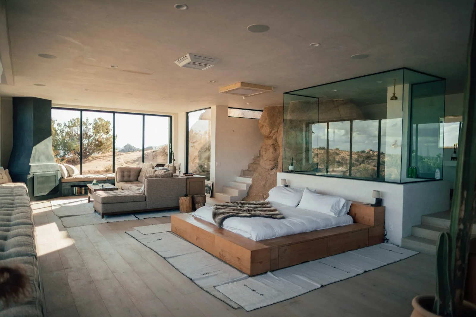 A calm bedroom with a made bed and a window view
