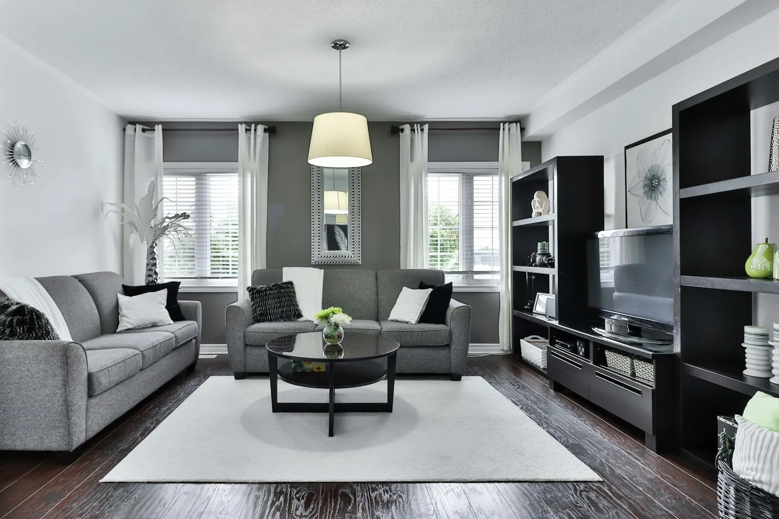 A tidy grey living room prepared for guests after a one-time cleaning